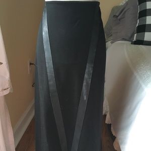 Black skirt, made in Italy. Back zipper and lace up back hem.